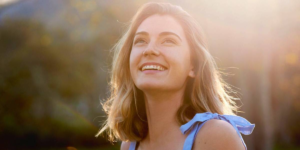 Person stretching in sunlight after waking up